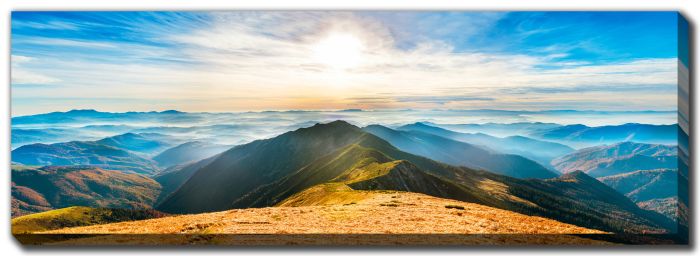 Sunlit Peaks And Misty Valleys